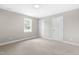 Spacious bedroom with plush carpet and a window at 98 Linda St, Princeton, NC 27569