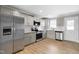 Neutral kitchen with stainless steel appliances, granite countertops, and wood flooring at 98 Linda St, Princeton, NC 27569