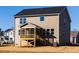 Backyard showcasing a screened in porch, level lot, and neutral siding at 370 Fast Pitch Ln, Four Oaks, NC 27524