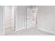 Bedroom featuring gray carpet and white trim with a view into an adjacent room at 370 Fast Pitch Ln, Four Oaks, NC 27524