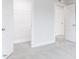 A bedroom showcasing an open closet and bright white trim details and gray carpet at 370 Fast Pitch Ln, Four Oaks, NC 27524