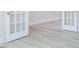 New hard wood style flooring is ready for final finishes such as baseboards and fresh paint at 370 Fast Pitch Ln, Four Oaks, NC 27524