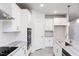 Well-lit kitchen featuring modern appliances, gray countertops, and ample cabinet space at 370 Fast Pitch Ln, Four Oaks, NC 27524