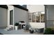 Backyard patio featuring an outdoor kitchen with a grill and stylish seating with view of the dining room at 3612 Bailey Meadows Drive Dr, Wake Forest, NC 27587