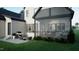 Expansive backyard featuring a screened patio with outdoor seating and a grill at 3612 Bailey Meadows Drive Dr, Wake Forest, NC 27587