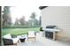 Backyard featuring an outdoor kitchen with a grill, seating and lush landscaping at 3612 Bailey Meadows Drive Dr, Wake Forest, NC 27587