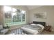 Bright bedroom featuring a large window with natural light, a cozy bed, and modern décor at 3612 Bailey Meadows Drive Dr, Wake Forest, NC 27587