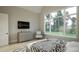 Serene bedroom with large windows overlooking the yard, modern furniture, and a neutral color scheme at 3612 Bailey Meadows Drive Dr, Wake Forest, NC 27587