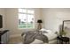 Bright bedroom with a large window, comfortable bed, and minimalist decor for a relaxing retreat at 3612 Bailey Meadows Drive Dr, Wake Forest, NC 27587