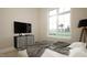 Well-lit bedroom with modern furnishings and a large window overlooking a serene landscape at 3612 Bailey Meadows Drive Dr, Wake Forest, NC 27587