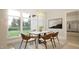 Inviting dining room with large window, modern chandelier, and stylish chairs for comfortable entertaining at 3612 Bailey Meadows Drive Dr, Wake Forest, NC 27587