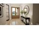 Welcoming entryway features wood-look tile flooring, modern mirror, and a stylish console table at 3612 Bailey Meadows Drive Dr, Wake Forest, NC 27587