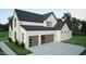 Modern two car garage featuring glass paneled doors on a beautiful two story home at 3612 Bailey Meadows Drive Dr, Wake Forest, NC 27587