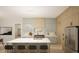 Modern kitchen boasts a large marble island, stainless steel appliances and pendant lighting at 3612 Bailey Meadows Drive Dr, Wake Forest, NC 27587