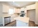 Modern kitchen featuring white cabinets, a central island, stainless steel appliances, and lots of light at 335 Tobacco Barn Dr, Angier, NC 27501