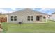 Backyard featuring a covered patio area and newly installed sod at 3604 Drafton Dr, Raleigh, NC 27610