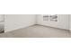 Bedroom featuring a bright window and neutral carpeting at 3604 Drafton Dr, Raleigh, NC 27610