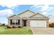 Charming single-Gathering home with brick facade, well-maintained lawn, and an attached two-car garage at 3604 Drafton Dr, Raleigh, NC 27610