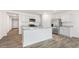 Open kitchen with a center island, stainless steel appliances, and granite countertops at 3604 Drafton Dr, Raleigh, NC 27610