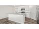 Bright kitchen with granite countertops, stainless appliances, and white cabinetry at 3604 Drafton Dr, Raleigh, NC 27610