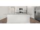 Spacious kitchen island with granite countertops and stainless steel appliances at 3604 Drafton Dr, Raleigh, NC 27610