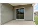 A covered patio area with sliding glass doors and vinyl siding at 3604 Drafton Dr, Raleigh, NC 27610