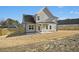 Back of home featuring a covered patio, fenced yard and traditional siding at 51 Blackberry Ln, Benson, NC 27504