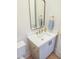A powder room that has a single sink, gold fixtures, and lots of storage at 2506 Silas Peak Ln, Apex, NC 27523