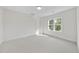 Bright bedroom features neutral carpet, white trim and lots of natural light at 2506 Silas Peak Ln, Apex, NC 27523