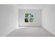 Bright bedroom features neutral carpet, white trim and lots of natural light at 2506 Silas Peak Ln, Apex, NC 27523
