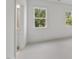 Bright bedroom features neutral carpet, white trim and lots of natural light at 2506 Silas Peak Ln, Apex, NC 27523