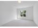Bright bedroom features neutral carpet, white trim and lots of natural light at 2506 Silas Peak Ln, Apex, NC 27523