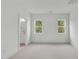 Bright bedroom features neutral carpet, white trim and lots of natural light at 2506 Silas Peak Ln, Apex, NC 27523