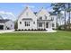 Beautiful two-story home boasts a manicured lawn and a modern aesthetic with black accents at 2506 Silas Peak Ln, Apex, NC 27523
