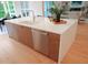 Large kitchen island with a sink, dishwasher, cabinets, and seating at 2506 Silas Peak Ln, Apex, NC 27523