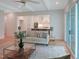 Bright living room with hardwood floors, modern furniture, and easy access to the kitchen at 2506 Silas Peak Ln, Apex, NC 27523