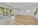 Bright living room with wood floors, recessed lighting and sliding glass doors leading to the outdoors at 2506 Silas Peak Ln, Apex, NC 27523