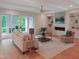 Inviting living room with fireplace, built-ins, neutral decor, and access to the outdoor patio at 2506 Silas Peak Ln, Apex, NC 27523