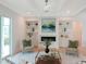 Inviting living room with fireplace, built-ins, neutral decor, and lots of natural light at 2506 Silas Peak Ln, Apex, NC 27523