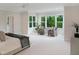 This is the view of a main bedroom with a seating area and large windows at 2506 Silas Peak Ln, Apex, NC 27523