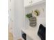 This mudroom has custom white cabinets and a bench with storage at 2506 Silas Peak Ln, Apex, NC 27523