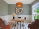 Stylish home office with wainscoting, neutral walls, modern lighting, and bright window at 2506 Silas Peak Ln, Apex, NC 27523