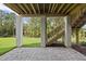Beautiful backyard patio with stone pavers and stairs leading to the yard at 2506 Silas Peak Ln, Apex, NC 27523