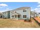 Spacious backyard with a covered patio area and ample room for outdoor activities at 124 August Pond Way # 138, Raleigh, NC 27603