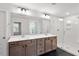 Bathroom featuring double sinks, granite counters, glass shower, and dark tile floor at 124 August Pond Way # 138, Raleigh, NC 27603
