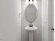 Powder room featuring a pedestal sink and modern faucet at 124 August Pond Way # 138, Raleigh, NC 27603