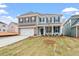 Attractive home exterior with blue siding, brick accents, and a well-maintained lawn and landscaping at 124 August Pond Way # 138, Raleigh, NC 27603