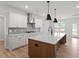 Well-lit kitchen featuring a large island, modern appliances, and plenty of cabinet space at 124 August Pond Way # 138, Raleigh, NC 27603