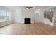 Bright living room features a fireplace, staircase, and multiple windows at 124 August Pond Way # 138, Raleigh, NC 27603