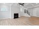 Bright living room features a fireplace, coffered ceiling, and wood-look flooring at 124 August Pond Way # 138, Raleigh, NC 27603